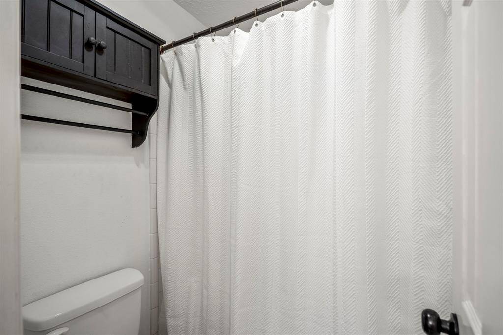 Take a look at the second full bathroom, located upstairs and thoughtfully designed with a separate shower and toilet area—perfect for added privacy and functionality.