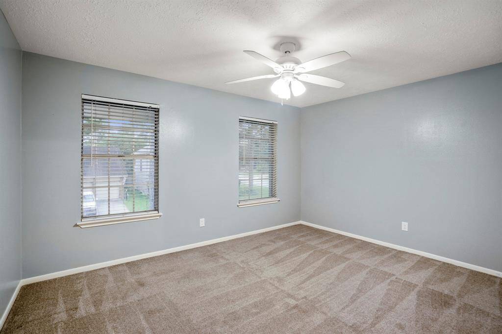 Bedroom number 4 is light, airy, and oh-so-inviting. It features soft plush carpet underfoot and a roomy walk-in closet—comfort and convenience all in one!