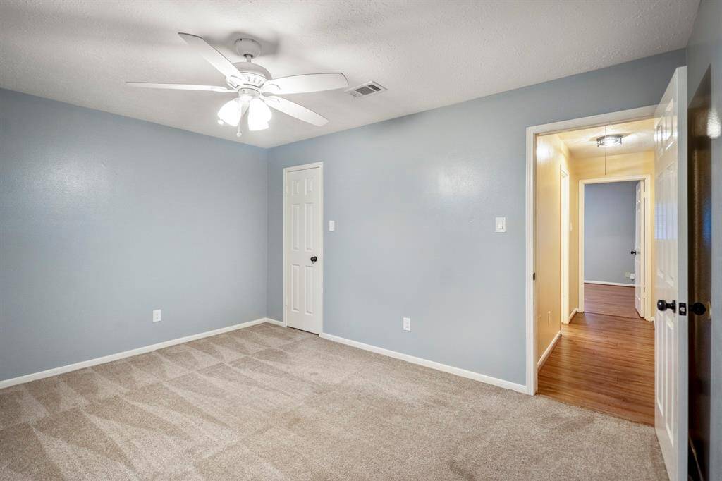 Bedroom number 4 is light, airy, and oh-so-inviting. It features soft plush carpet underfoot and a roomy walk-in closet—comfort and convenience all in one!