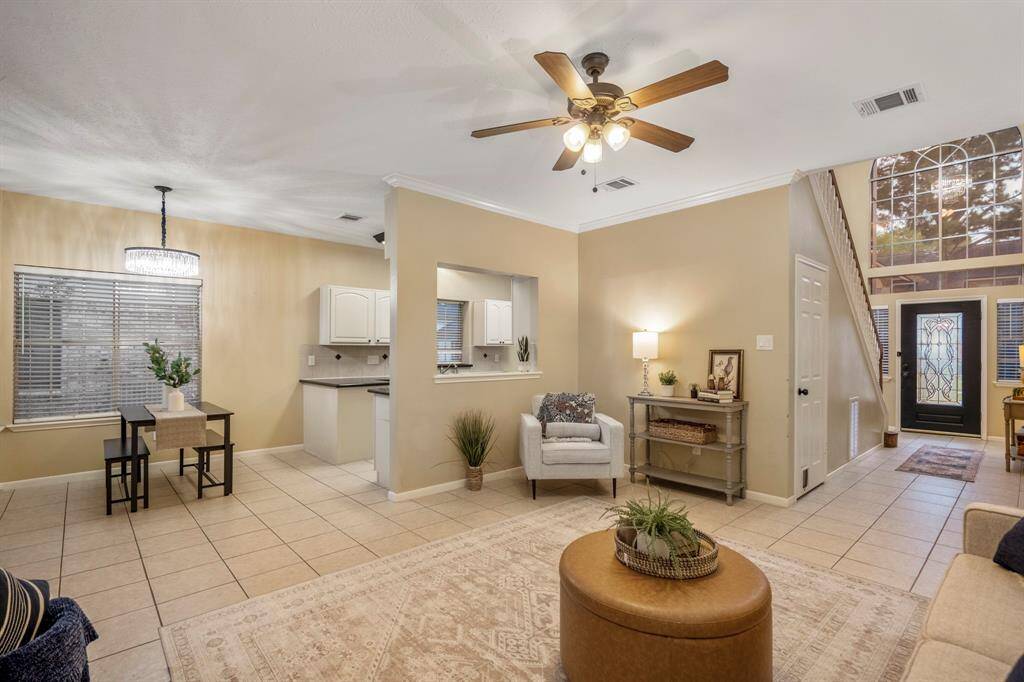 Peek from the living room into the cozy eat-in dining area—perfect for casual meals, coffee chats, and everyday moments.