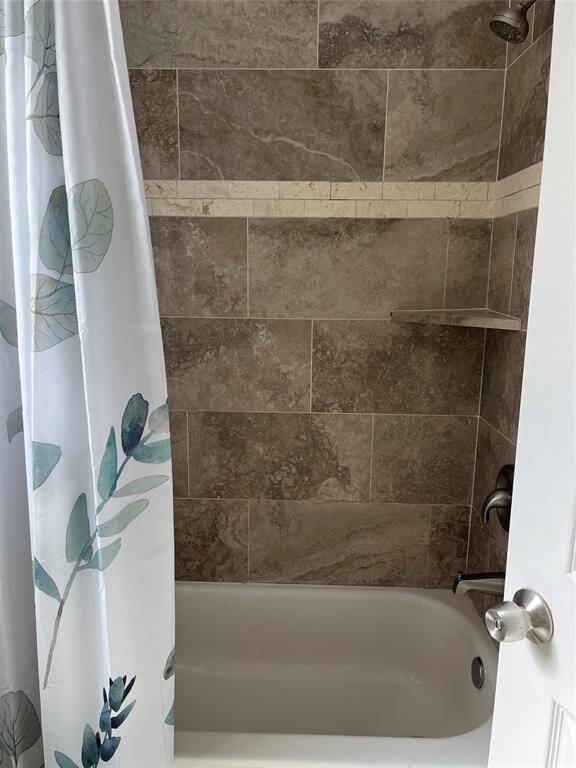 Primary bathroom has large shower space.