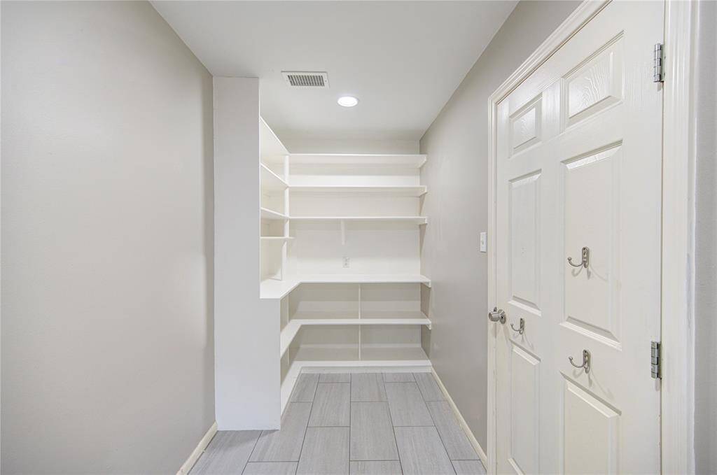 Other side of laundry room.  This can be used as a MUD room or pantry