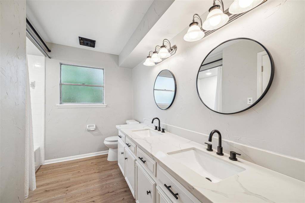 Third full bath-shower/bath combination. Granite counter tops, new mirrors, sinks, and toilet.