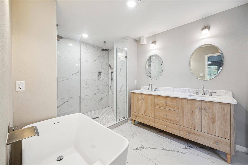 Primary bath completed gutted, everything is new! huge shower for 2, beautiful tile selection.