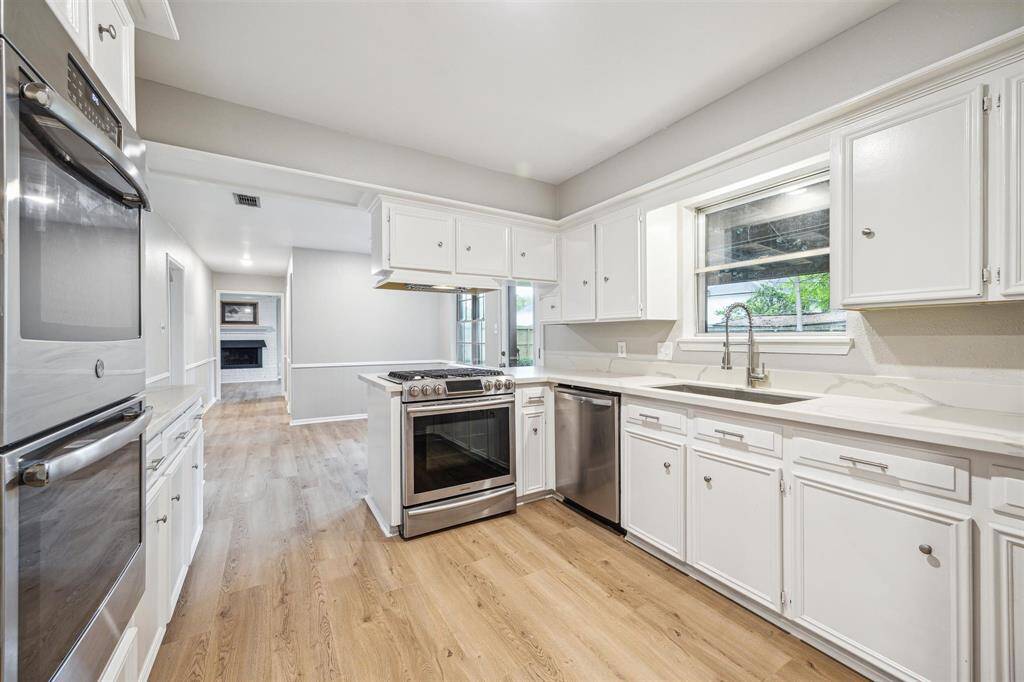 Granite countertops, laminate flooring throughout, double ovens, stainless steel appliances, double ovens.
