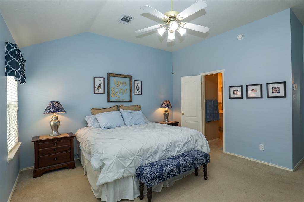 The primary bedroom is spacious with plenty of room for your king sized bed and other furniture.