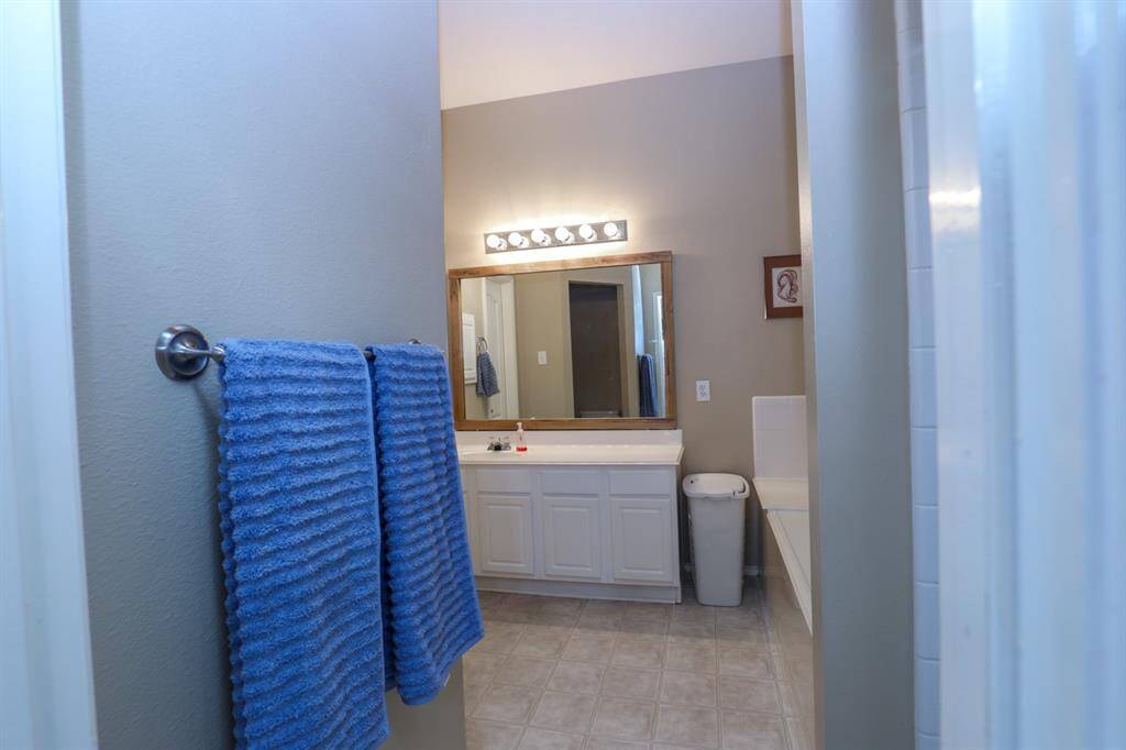 The primary bath has a separate tub and shower and a large walk in closet.