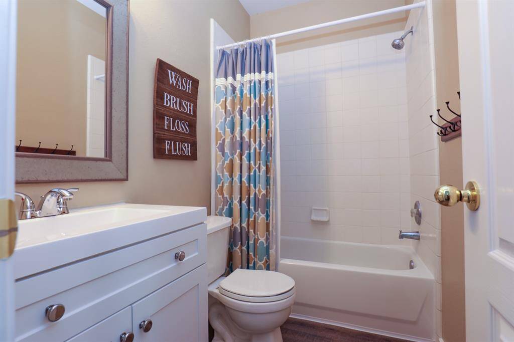 The secondary bathroom is conveniently located near the 3 secondary bedrooms and the living area.