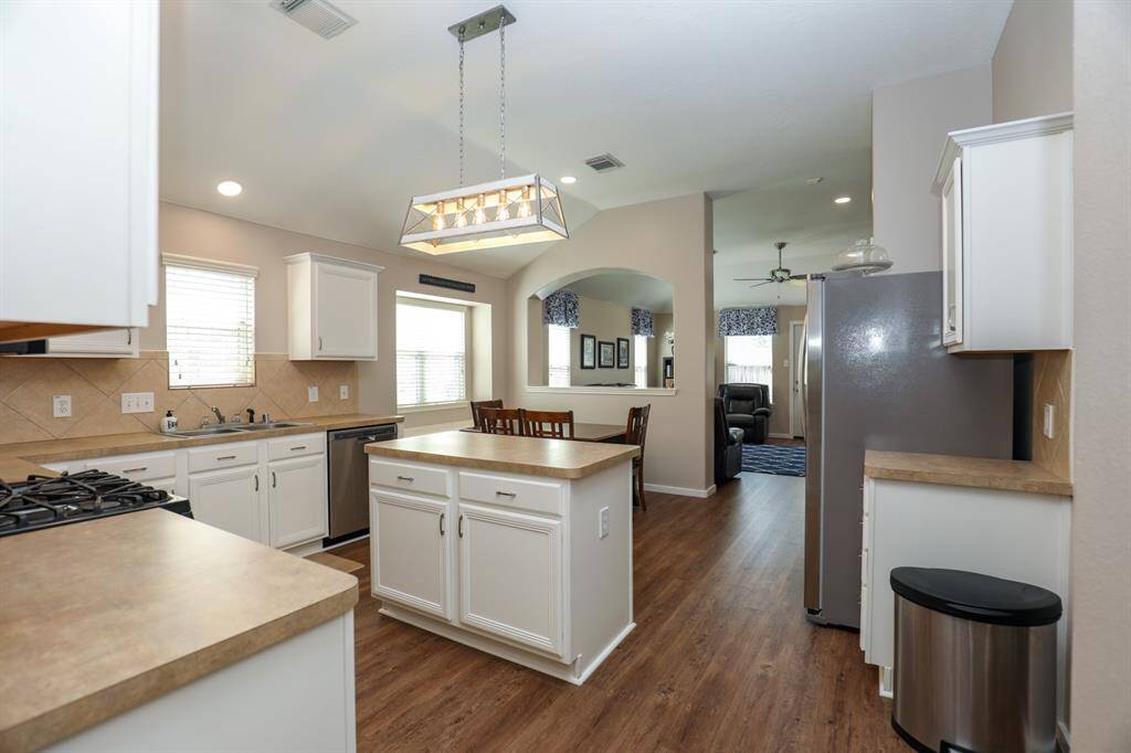 The kitchen is open and spacious with a large pantry and island.  There's plenty of counter and cabinet space.