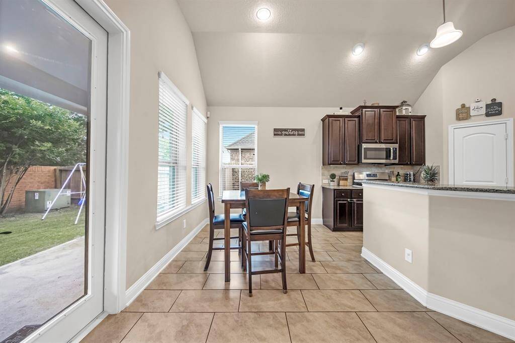 Breakfast nook with views of the patio and backyard.