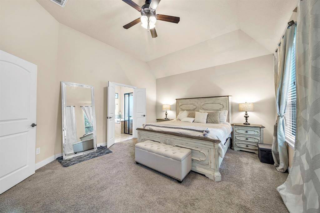 The Primary suite is a generous size with a view of the backyard.