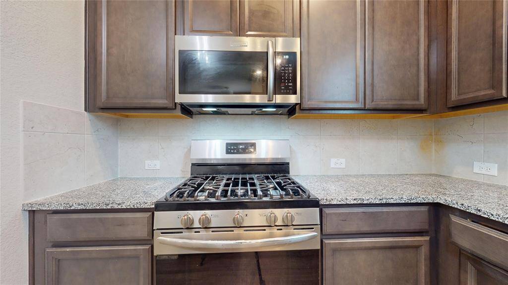Sleek stainless steel appliances enhance the modern kitchen.
