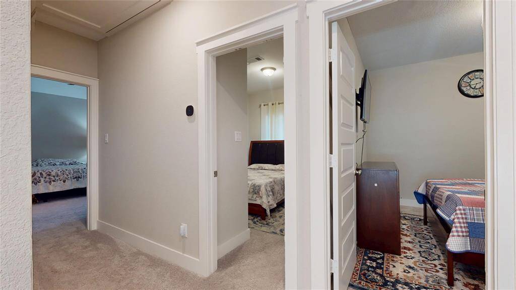 Explore the second floor featuring three spacious bedrooms, a convenient laundry room, and both a primary and guest bathroom.