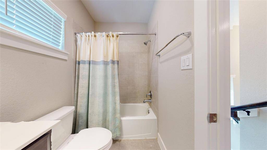 Compact and inviting guest bathroom with modern fixtures and a soothing color palette.