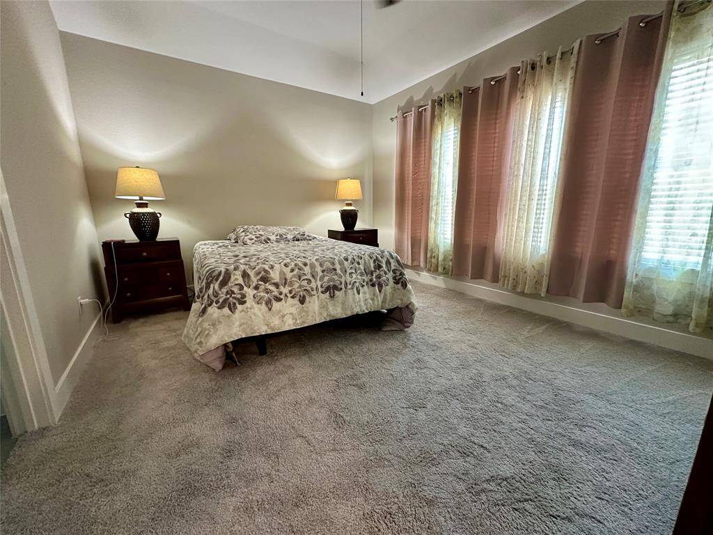 Spacious walk-in closet in the primary bedroom, featuring ample shelving and hanging space for all your storage needs.