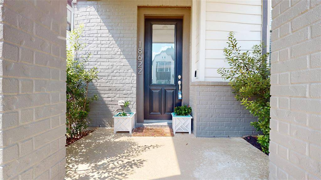 Inviting front entrance with a charming patio.