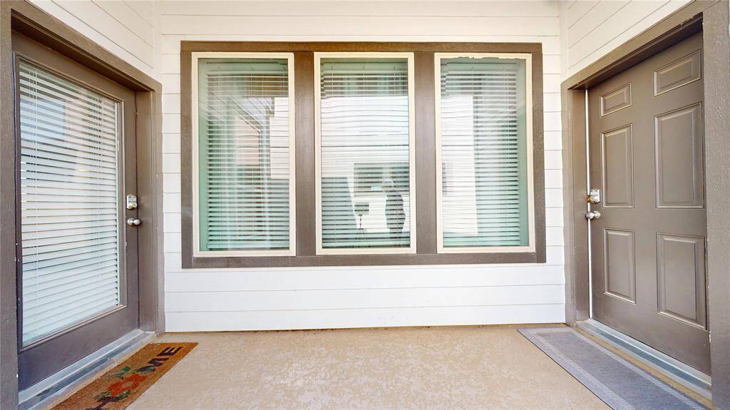 Covered patio leads to the garage door.