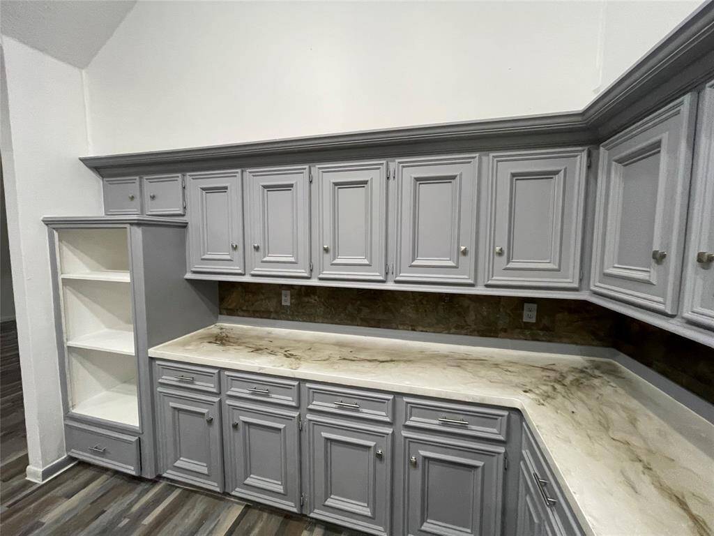 Upgraded kitchen with many cabinets