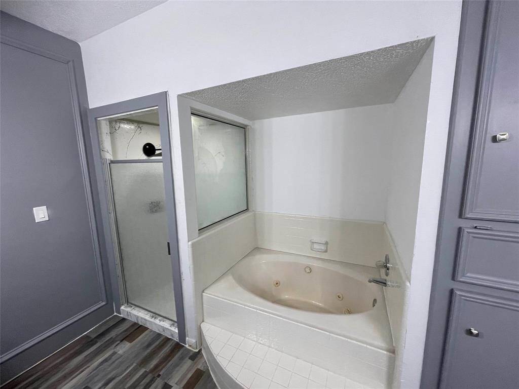 Master bathroom with jacuzzi and standing shower