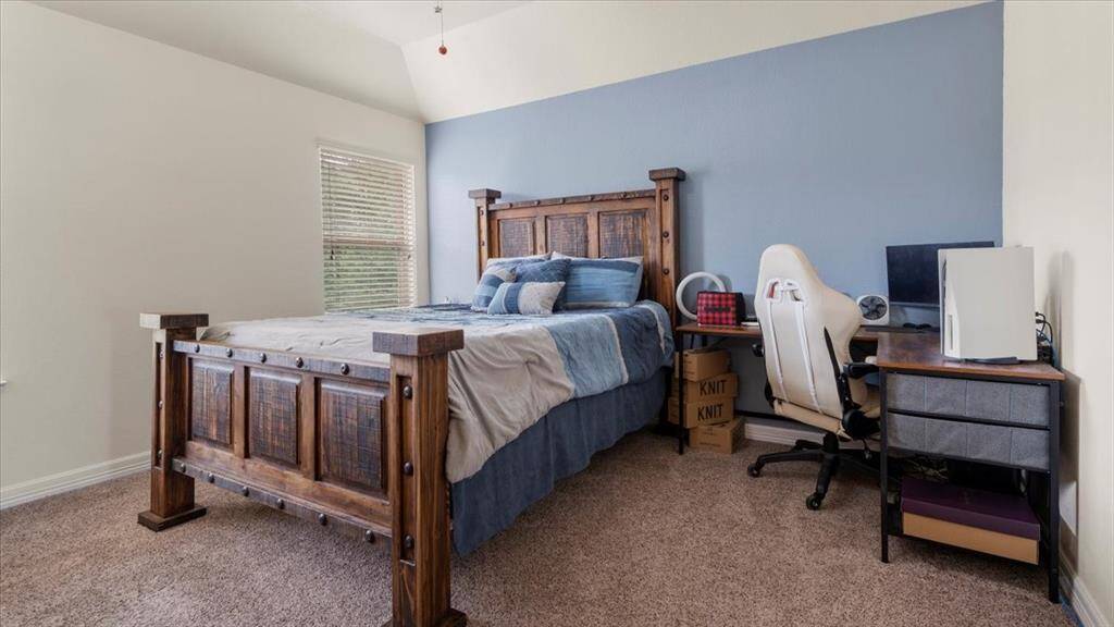 The second bedroom connected to the Jack-and-Jill bathroom, can comfortably accommodate a large bed, dresser, and a desk.