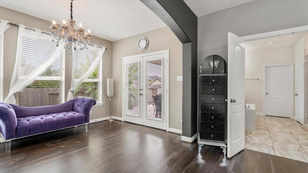 The primary bedroom includes private access to the back patio, allowing for a seamless indoor-outdoor living experience—perfect for enjoying morning coffee or unwinding in the evening.