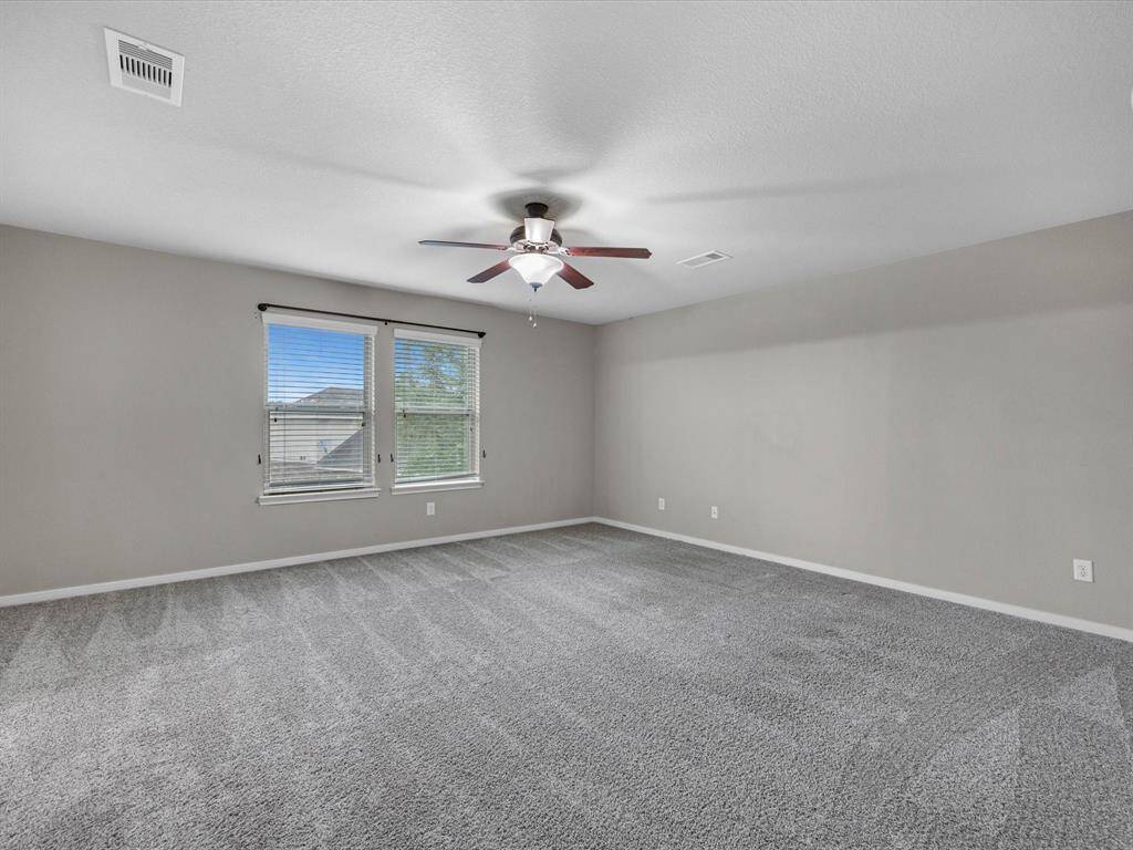Primary bedroom right off the gameroom.