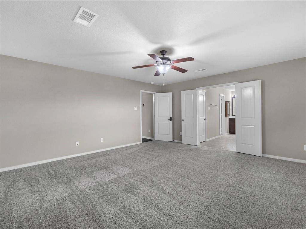 Another view of the primary bedroom.