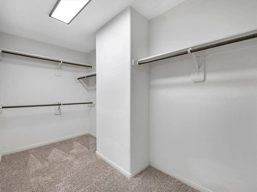 Primary walk in closet.