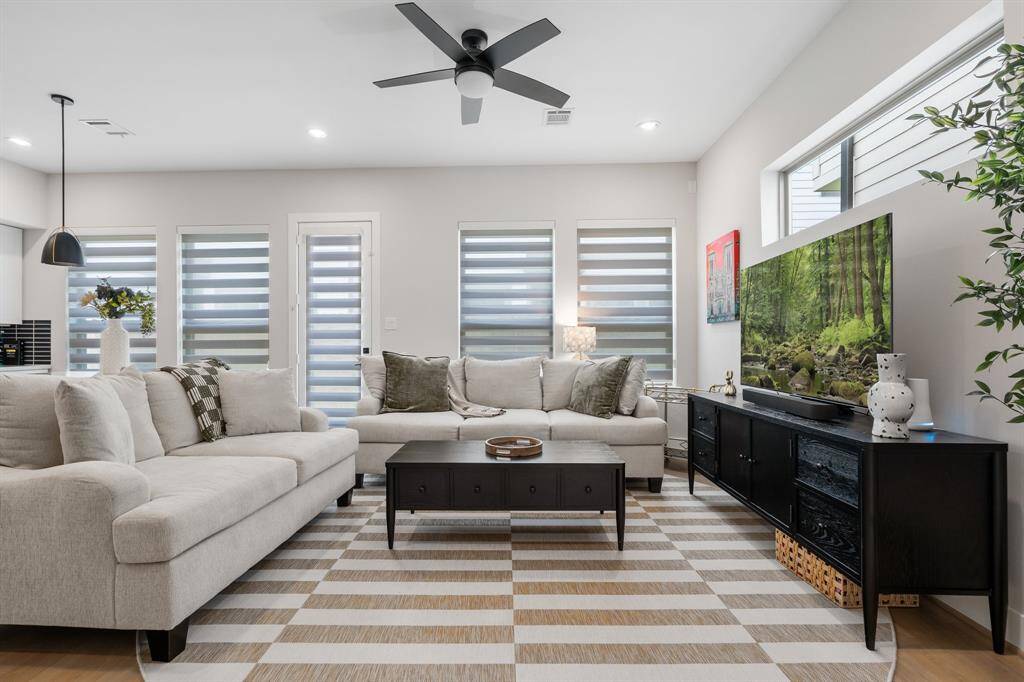 Love all the windows and the custom shades that allow light but are private too.