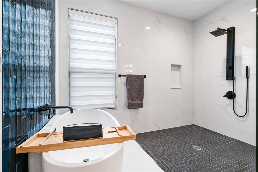 Fantastic oversized tiled shower with soaker tub.
