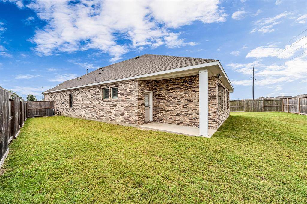The covered patio provides ample room for placing your grill, making outdoor cooking and entertaining a breeze. With the backyard being a blank canvas, it's ready for a new owner to create their own outdoor oasis according to their preferences and style.