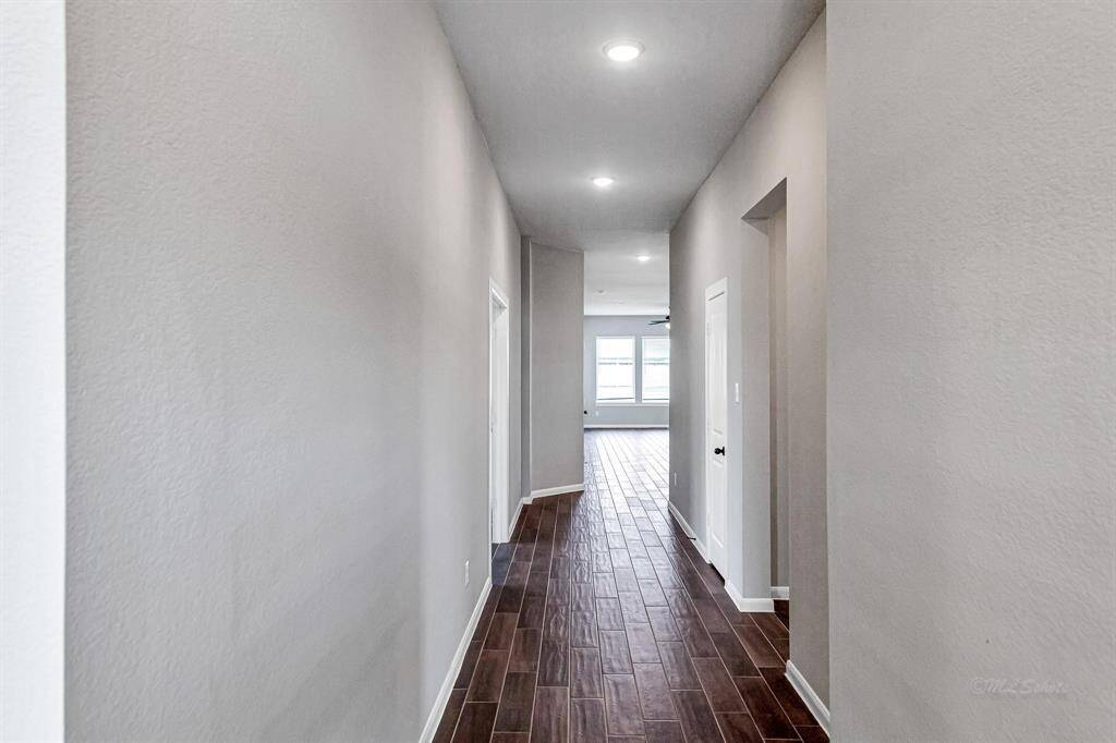 Welcome to this sought-after floor plan, offering 4 bedrooms, 3 full bathrooms, and an office. To the left, French doors lead into the home office, while to the right, you'll find the guest bedrooms.