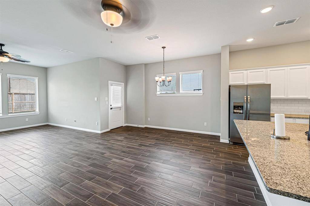 Here's another view showcasing the formal dining space and breakfast bar.