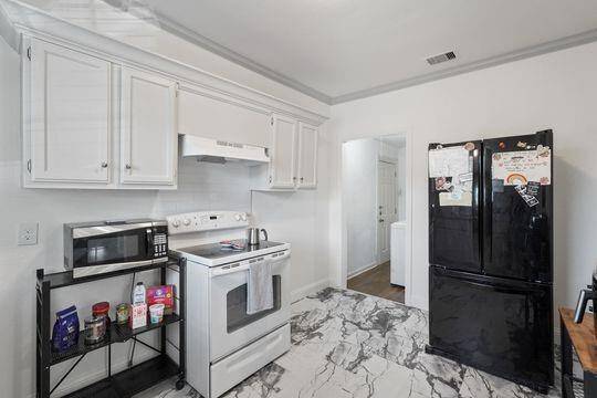 Kitchen leading to the utility room