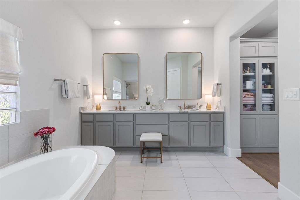 Master Bath with upgraded mirrors and granite.