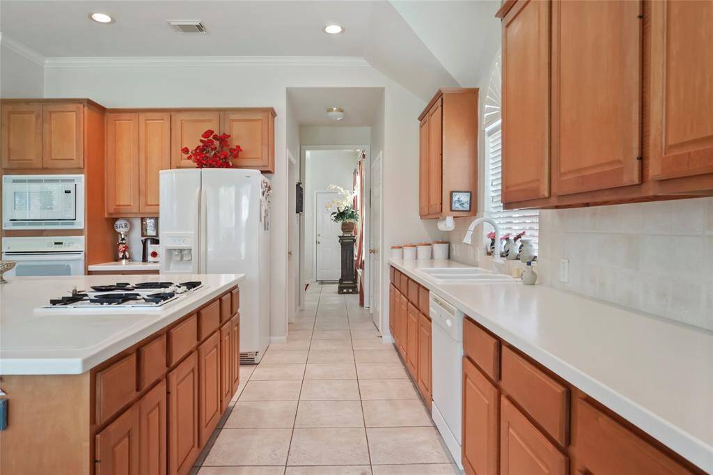 Solid surface counters. Tile floor.