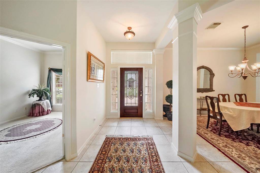 Leaded glass door. Formal dining room, office or study on the left.