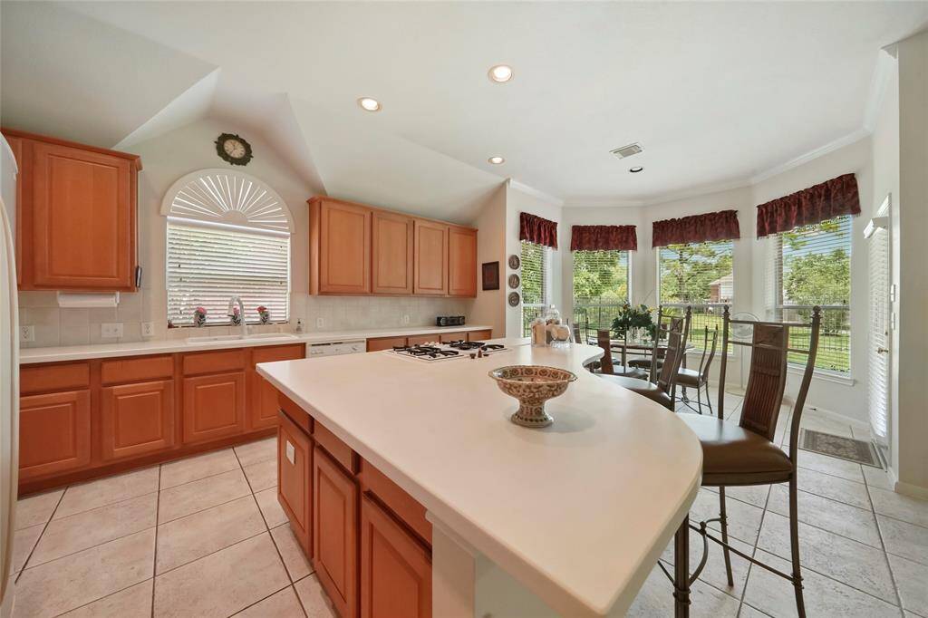 Unique shape island with space for two or four bar stools.