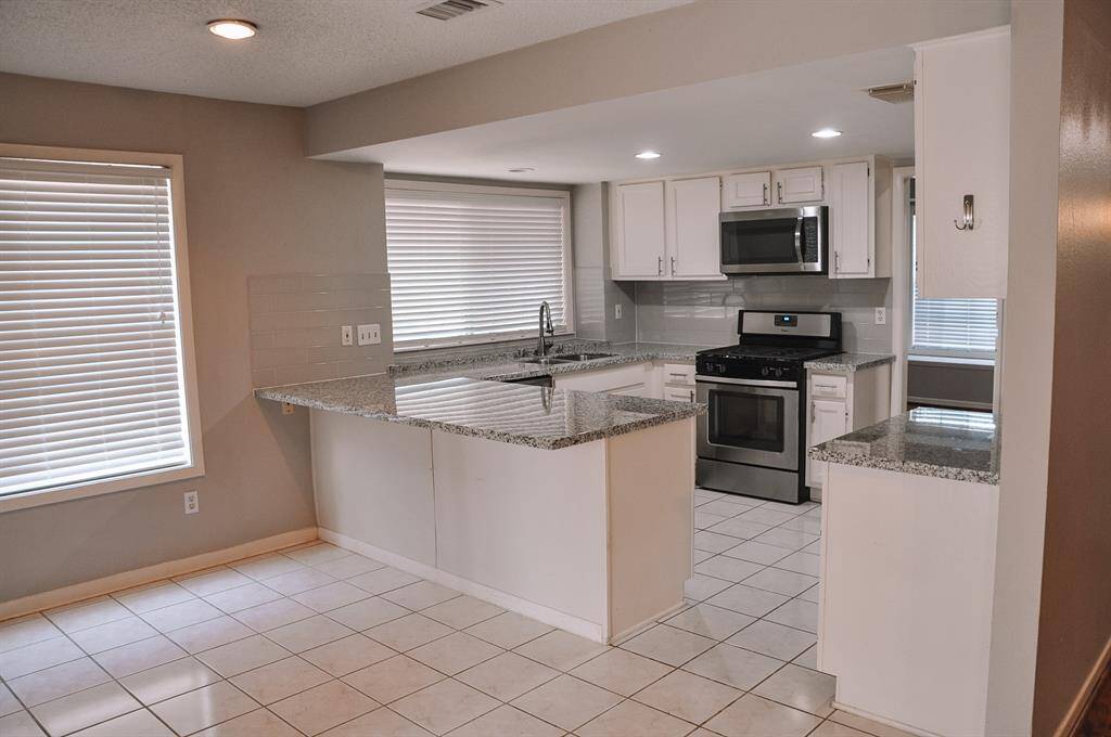 Breakfast room leading into the kitchen