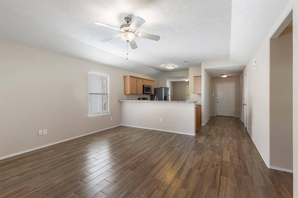The kitchen opens to the den, perfect for entertaining!