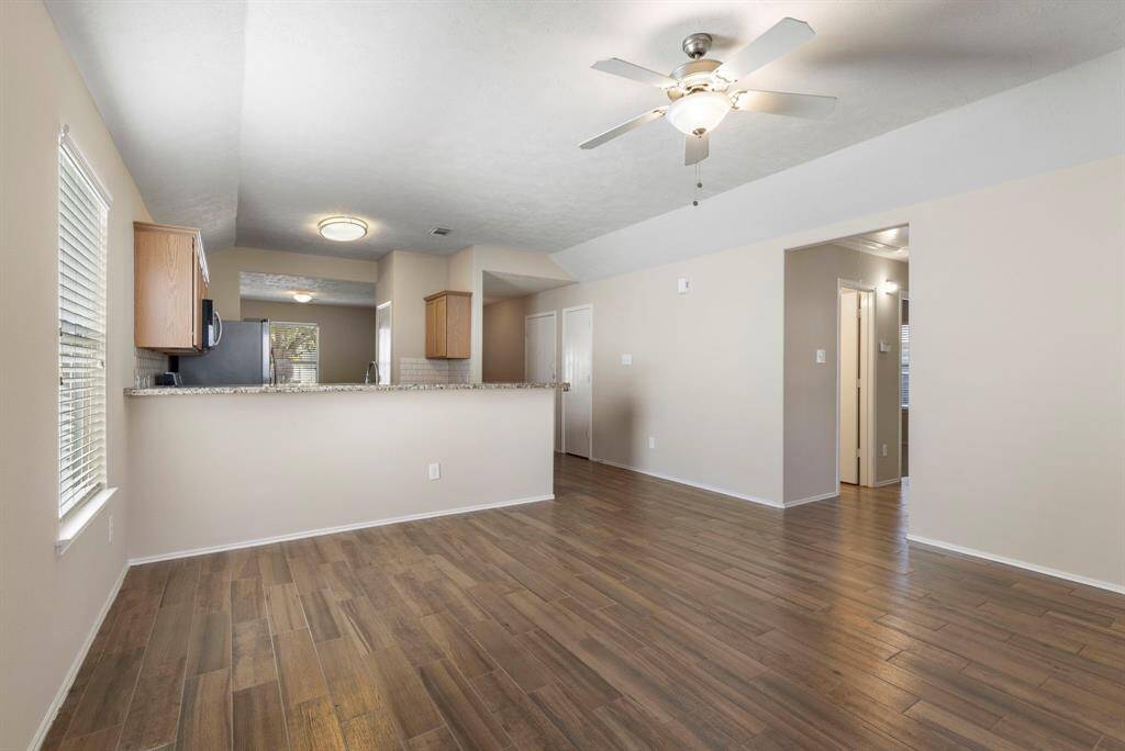 Additional view of kitchen and hallway leading to the bedrooms.