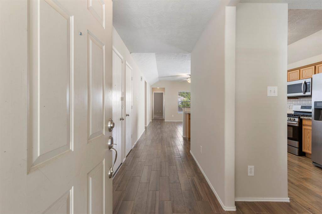 The foyer has tile flooring and a coat closet.