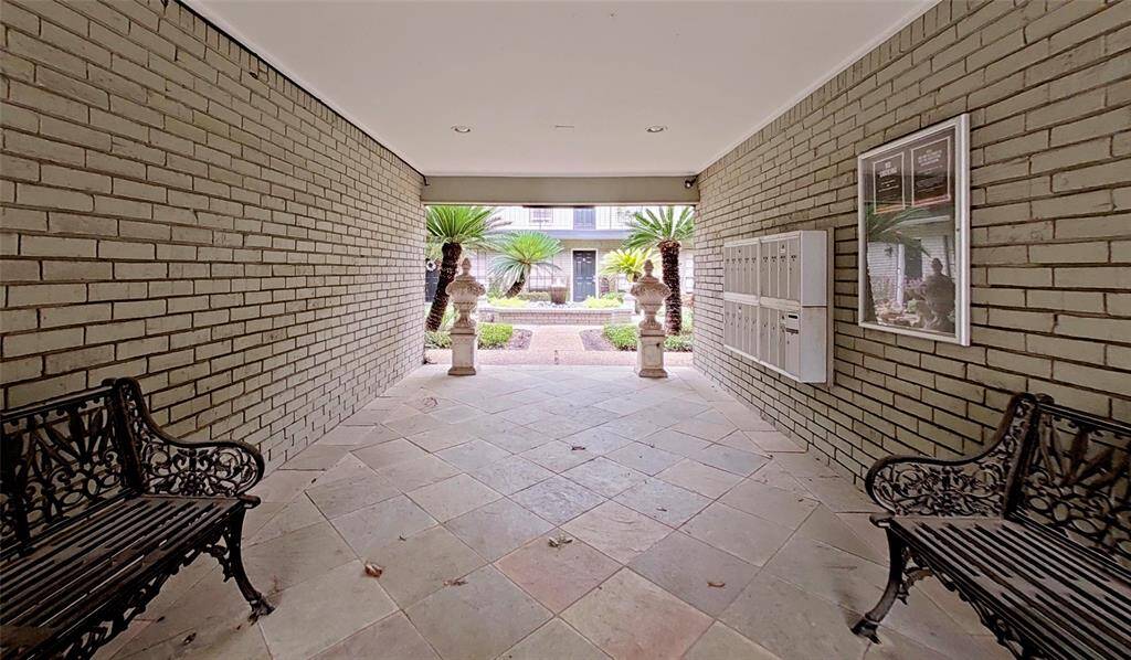 The community mailboxes are located within the gated entryway to the courtyard. Such a charming building and grounds!