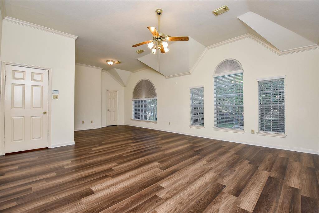 This spacious master bedroom offers a tranquil retreat, with ample room for a large bed and additional furnishings.