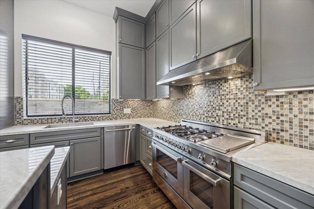 Kitchen.  Beautiful 48 inch gas range with 6 burners and griddle.  SS appliances.