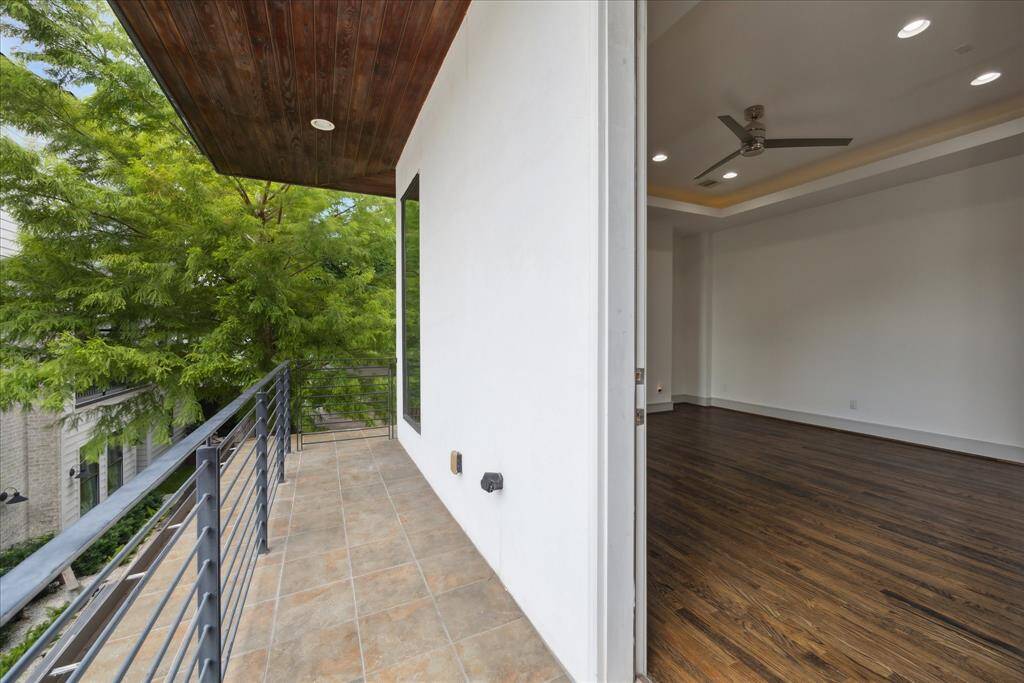 Primary bedroom with private balcony.