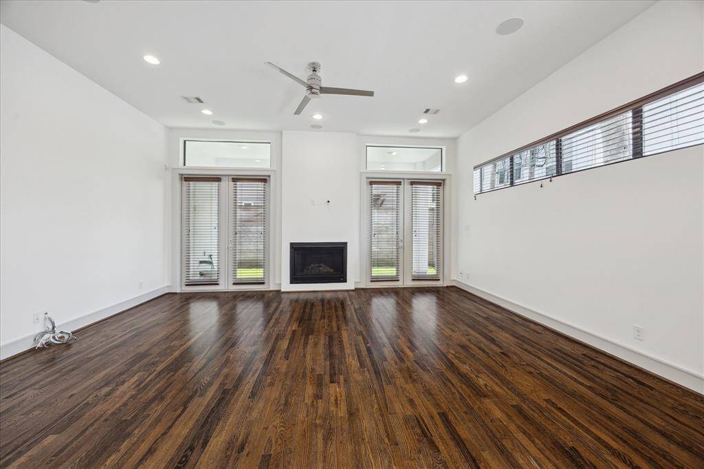 Living Room. Double doors open onto a private covered paito and back yard.