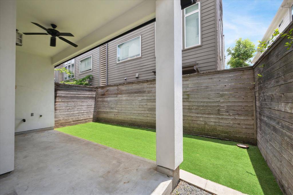 Covered porch/patio in backyard with soft vibes.