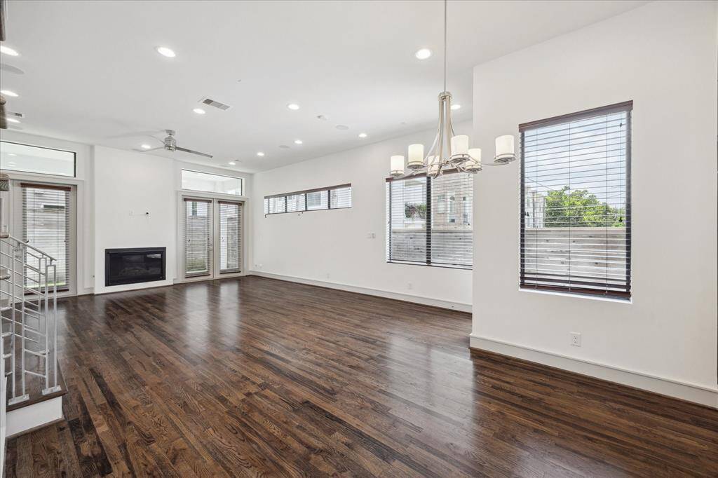 Dining Room, open to living spaces.   Note the high ceilings and great natural light from the windows.