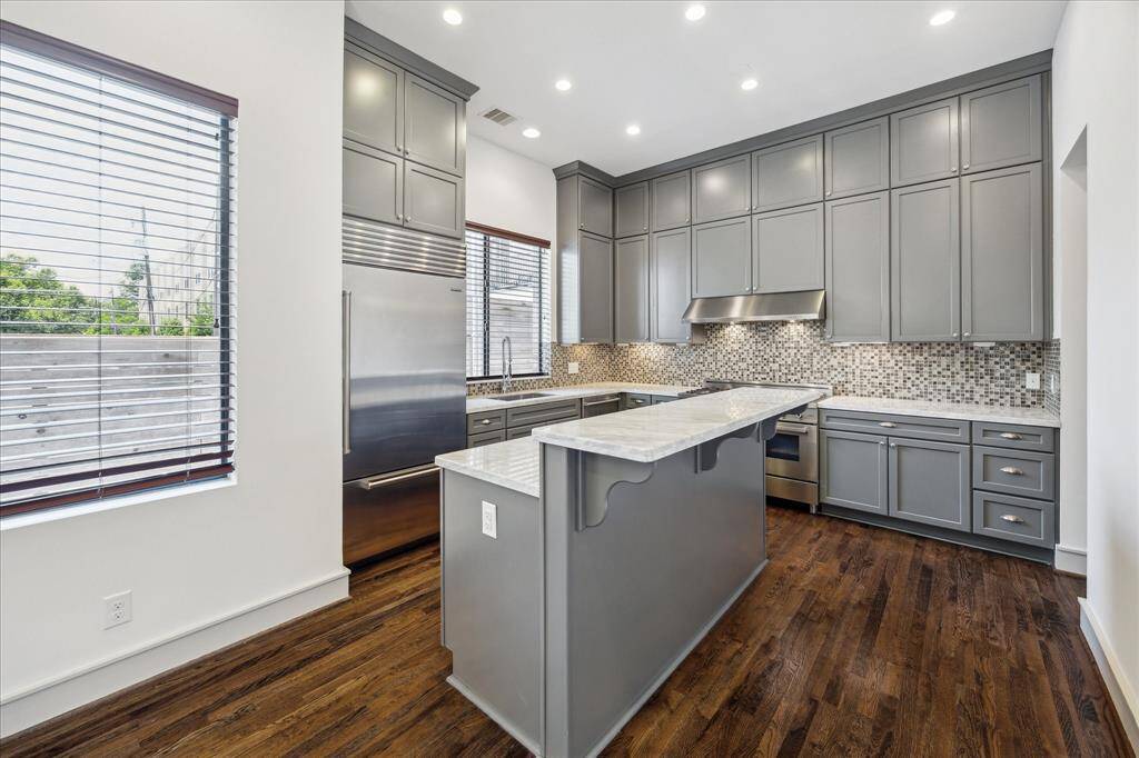 View into the Kitchen, with custom cabintery.